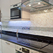 Pristine finish mosaic executed by hand. A range of textures, surfaces combine to add interest to the finished kitchen.